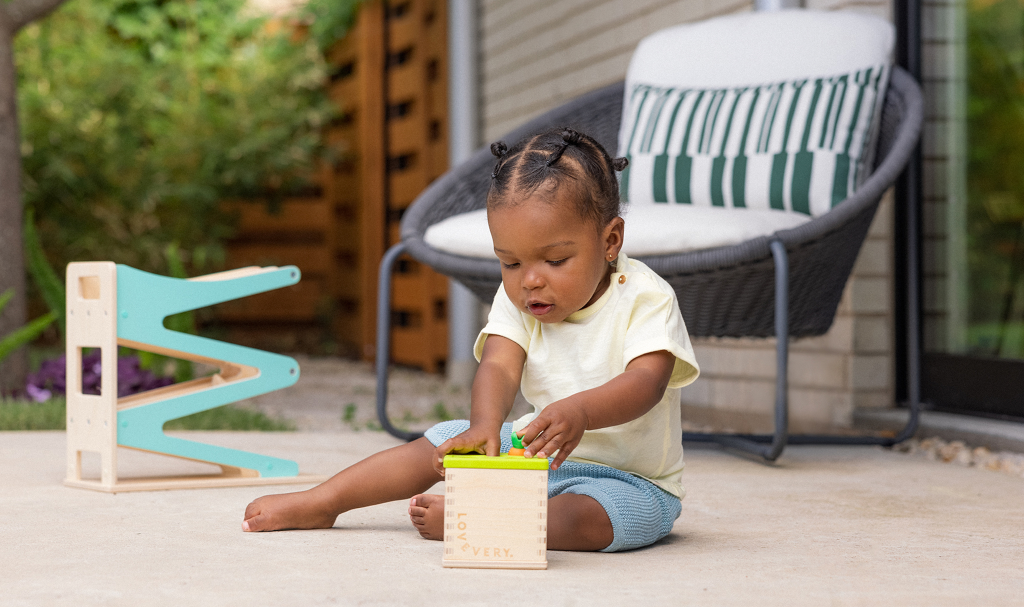 Baby enjoying sensory play activities — developmental signs baby is ready for nursery and learning through play